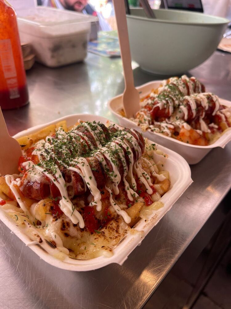 Korean-style food with fries, sausage, and sauce, from Manna Seoul